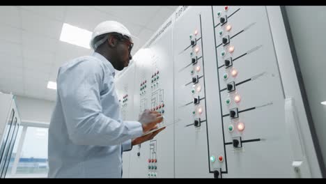 engineer working on control panel in power plant