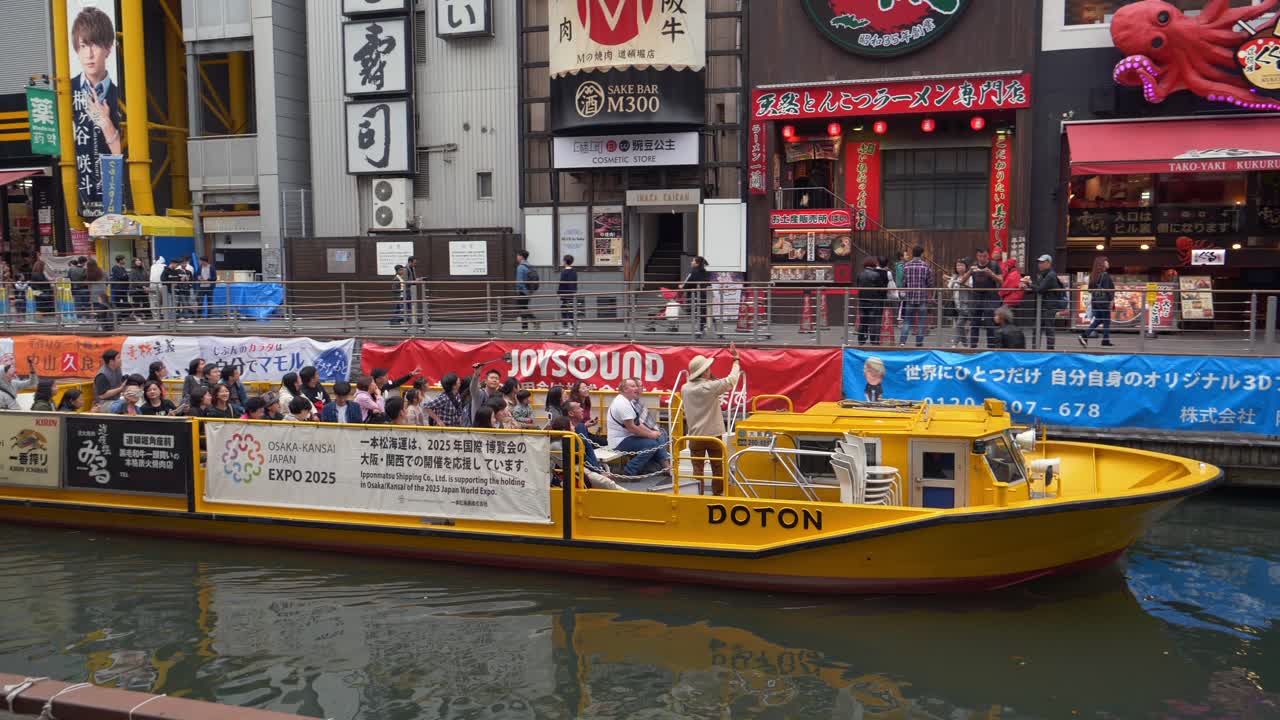 Boat Tours and City Life on Dotonbori Canal in Osaka, Japan