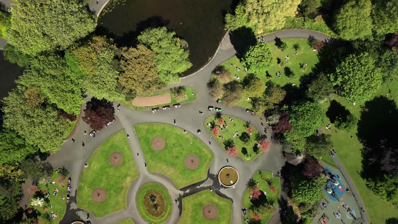 Forward travelling overhead aerial video of St Stephen's Green in Dublin City Centre, County Leinster, Ireland, on a bright and sunny day. Produced in 4K, 60FPS and with Rec709 color.