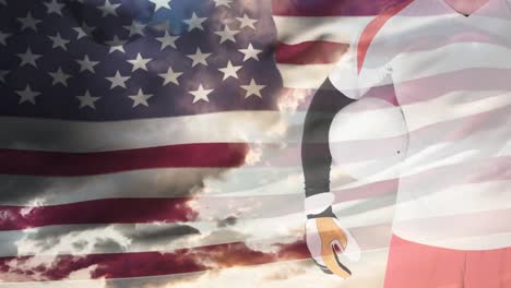 Animation-of-flag-of-usa-waving-over-midsection-of-male-soccer-player