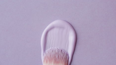 purple paint brush stroke on lavender background