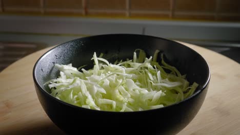 pouring boiling water on sliced cabbage, cooking scrambled eggs