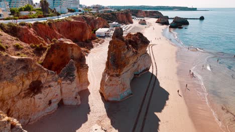 aerial view of a sunny portuguese beach with cliffs