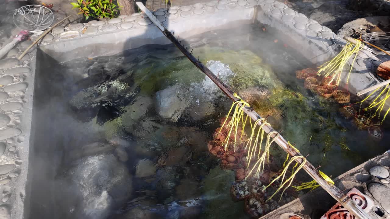 Eggs boiling in hot springs of Chiang Rai Thailand traditional eco friendly way