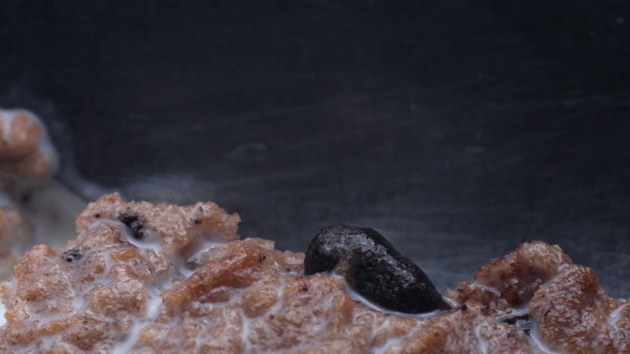 Slicing through moist cake with a spoon, showcasing its texture and layers