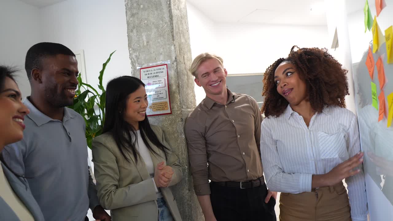 Diverse Team Brainstorming Ideas in Modern Office