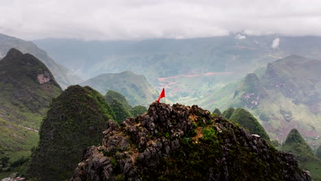vietnam flag on top of mountain. aerial backward