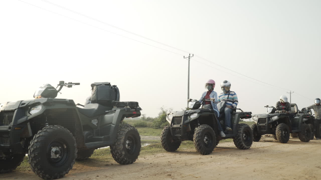 Tourists preparing for their ride on ATV. Offroad.