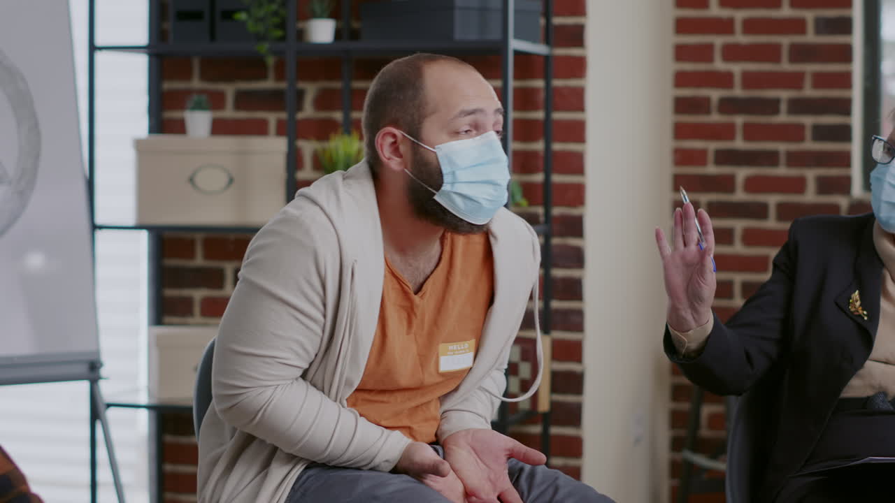 Desperate man complaining about anger management issues with therapist at aa meeting