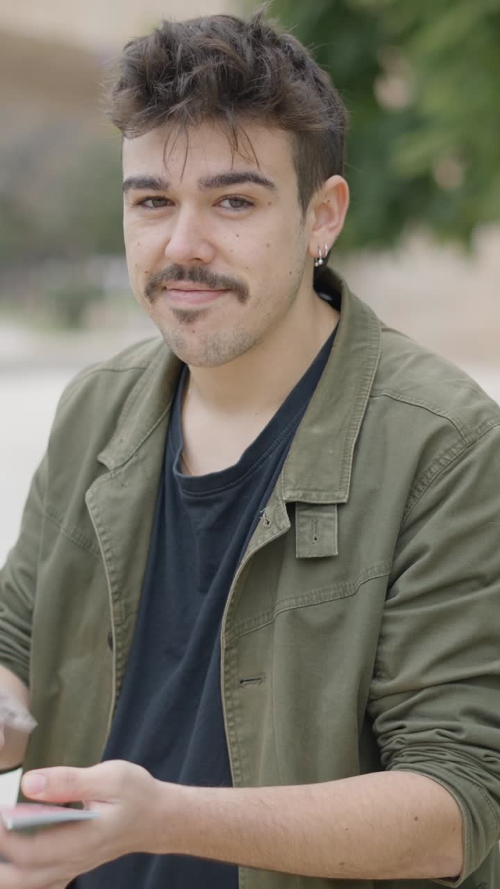 Man Performing a Card Trick Outdoors