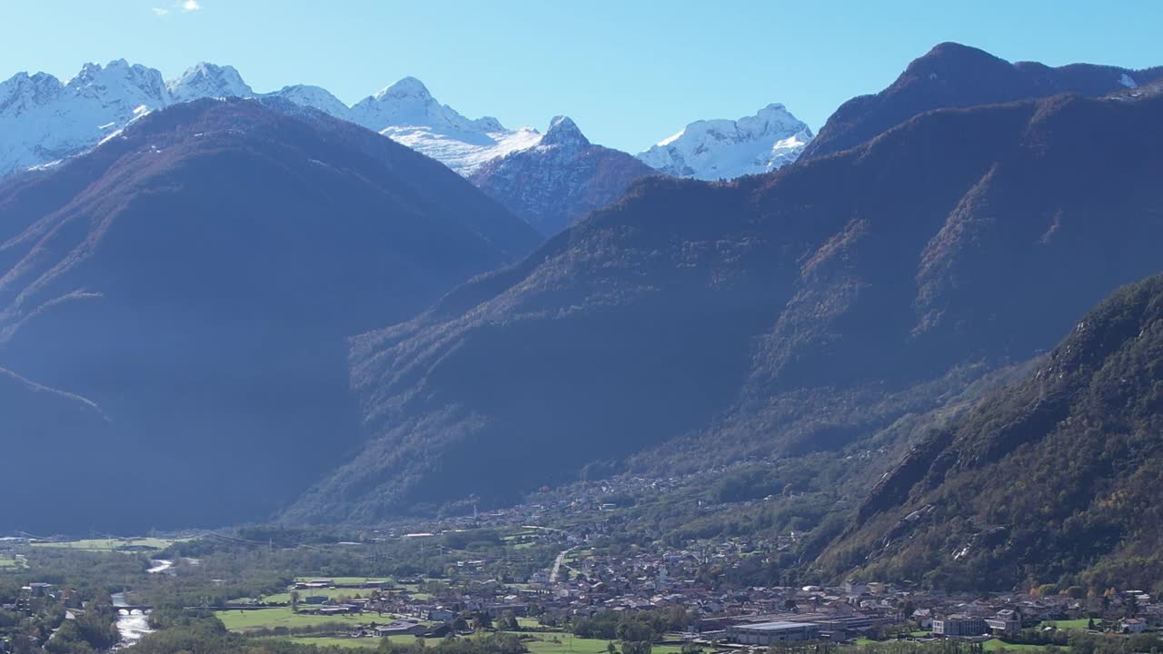 Breathtaking aerial view of Italian Alps surrounding a quaint village