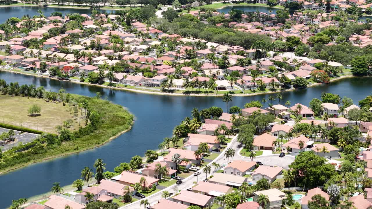 Drone Shot of Upscale Residential Community in Florida USA, Expensive Homes by Lake and Canals