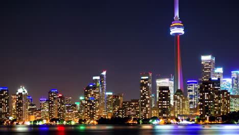 toronto skyline at night with cn tower reflection