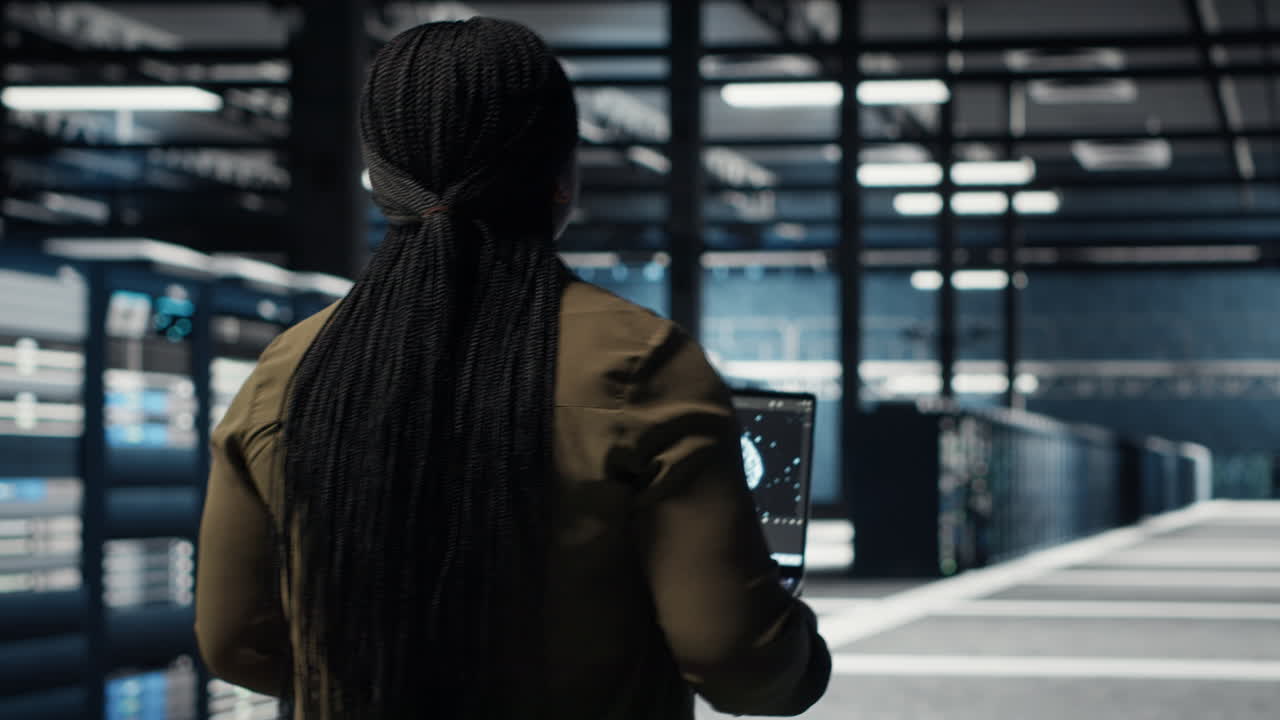 Data center engineer using deep learning on laptop to optimize operations