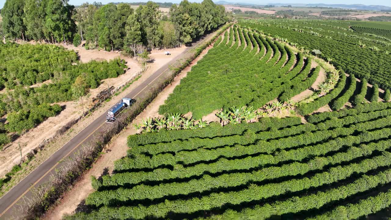 Cargo truck at scenic rural road at Mato Grosso. Rural landscape. Cargo Truck green background. Countryside landscape at green mountain valley. Farming scenery. Agriculture field plantation