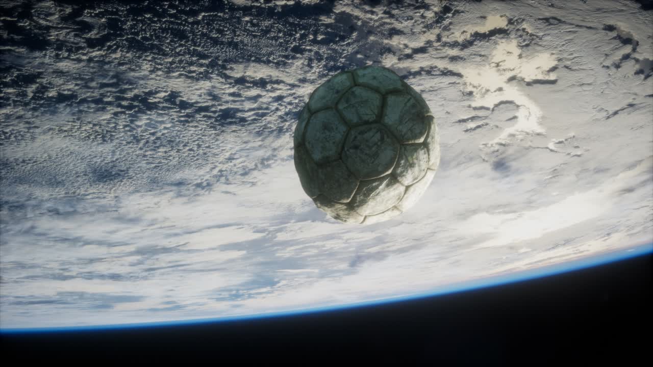 vieja pelota de fútbol en el espacio en órbita terrestre