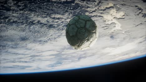 old soccer ball in space on earth orbit