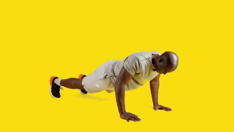 strong and sportive african man doing push ups
