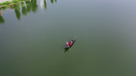 boat floating on water. view from above on gondola sailing along the wide river. romantic atmosphere. aerial view.