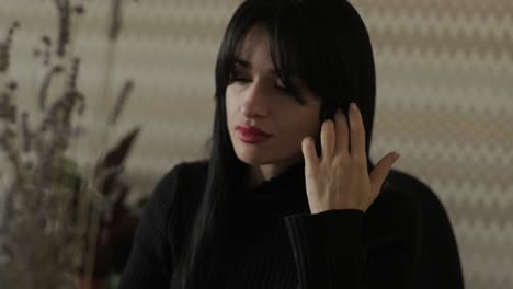 professional woman in a modern office environment, focused on work, dressed elegantly in business attire, surrounded by office equipment and a sleek interior