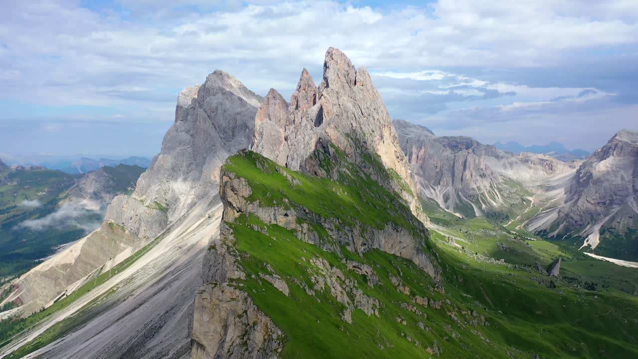 View of Seceda mountain in the Dolomites in summer, aerial circle shot right