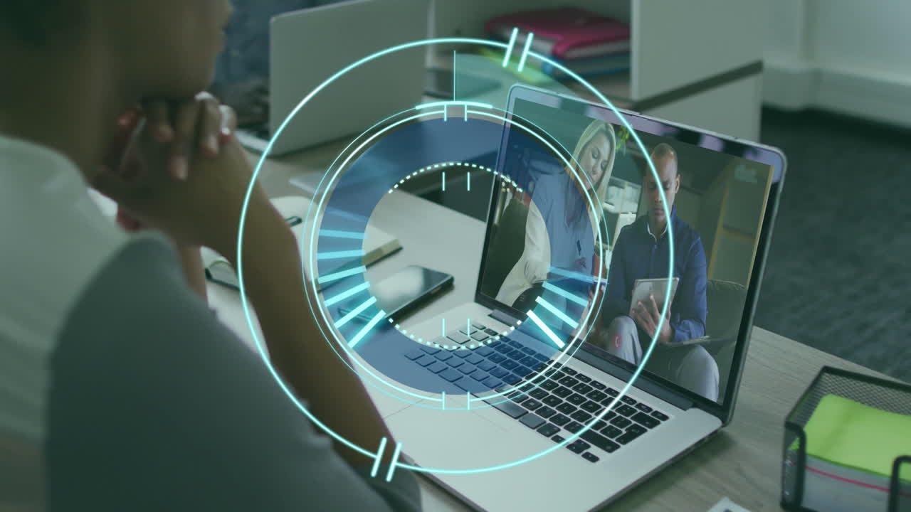 Watching animation on laptop, person in school engaged in video call