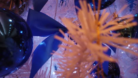 stabilized extreme close up movements across beautiful blue themed christmas tree version five