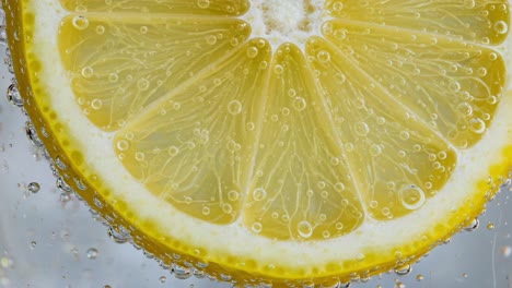 lemon,fruit,yellow,slice,bubble,water,fresh,citrus,refreshing,soda,drink,juicy,closeup,texture,ripe,vibrant,healthy,beverage,zest,natural,carbonated,sparkling,slices,cooking,ingredient,photography,background,detail,season,vitamin,acidity,refreshment,color,cold,display,cleansing,decor,style,dressing