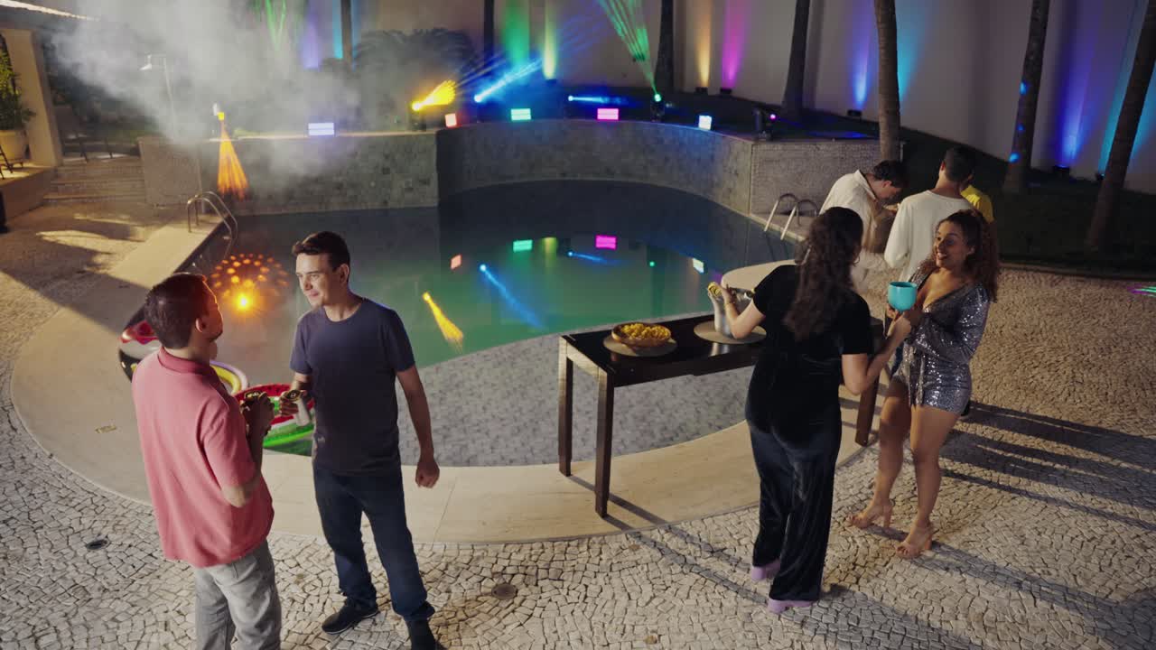 Friends Celebrating at a Vibrant Night Pool Party with Laser Lights and an LGBTQ+ Flag