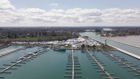 Off-Season-Empty-Marina-Docks-Next-to-Boats-Storage-Area,-Outside-Nautical-Parking-Waterfront-Dock-at-Port-Dalhousie-Pier-Ontario-Canada,-Harbor-Quay-and-Coastal-Landscape,-Aerial-View