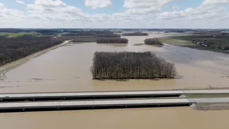 Flooded-area-in-southern-Indiana-farmland-next-to-freeway-with-drone-video-wide-shot-moving-forward