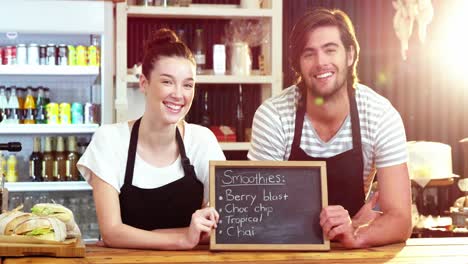 Waiter-and-waitress-holding-a-menu