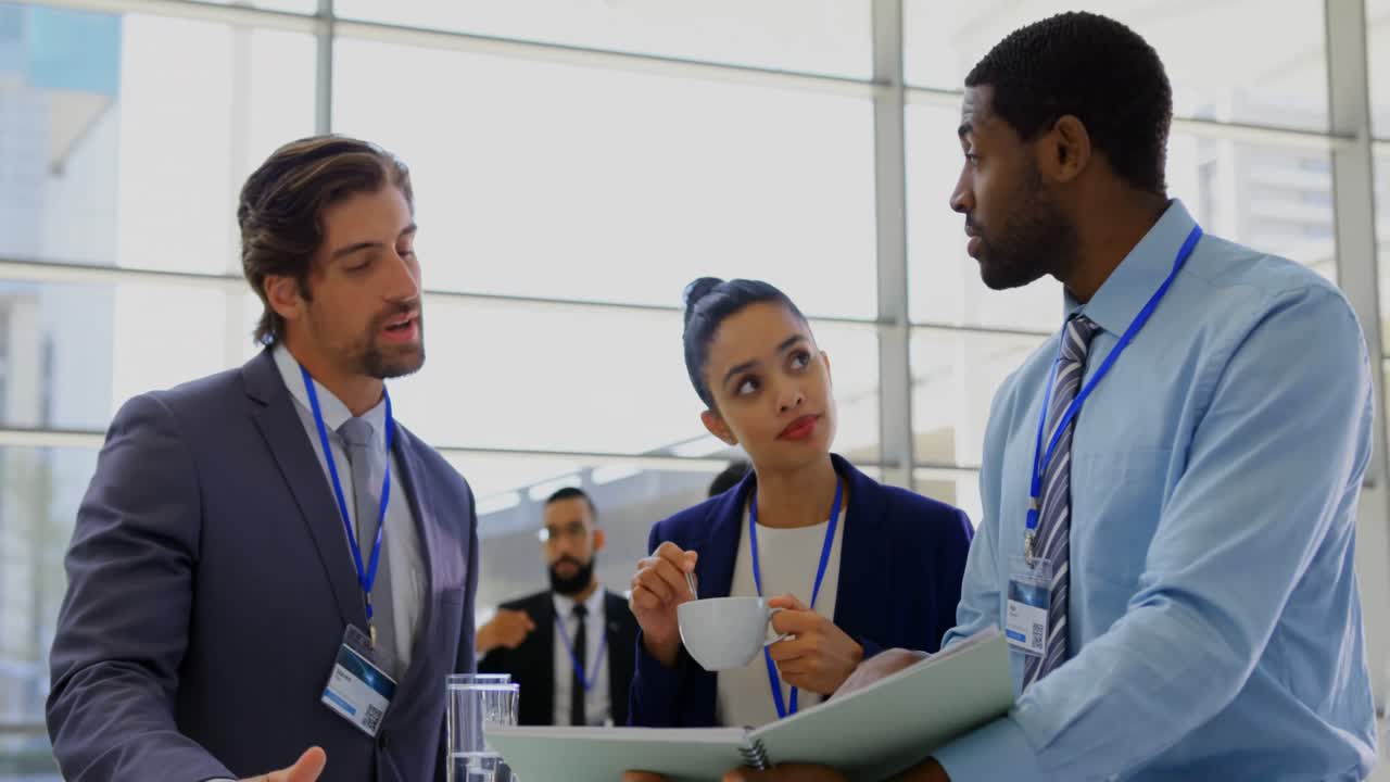 Multi ethnic business people discussing over a file during a seminar 4k