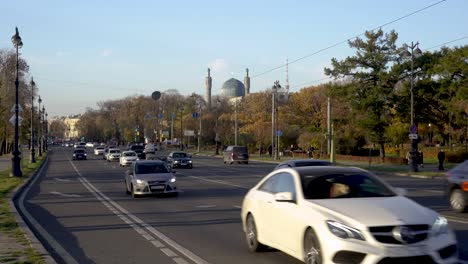 russia saint petersburg car traffic. kamennoostrovsky prospect, mosque in the background. 6/10/2021 am 17.00 editorial video.