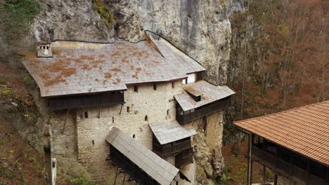 beautiful old monastery built into serbian mountainside rock