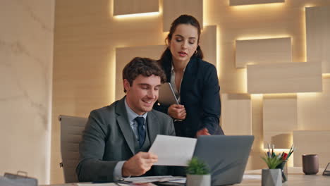 business supervisor helping colleague workplace closeup. woman consulting intern