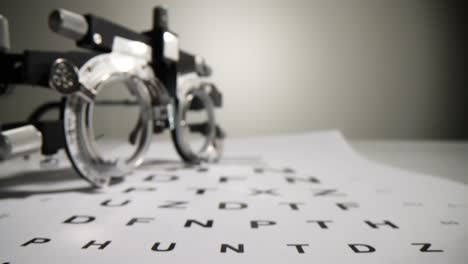 eye examination with phoropter and vision chart