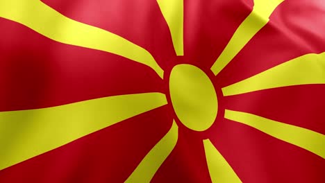 realistic waving flag of north macedonia, red field, golden yellow sun with eight rays. balkan nation symbol, skopje, patriotism, north macedonia