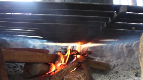 rural firewood kitchen made of mud with black iron grill