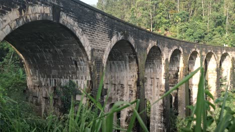 the nine arch bridge, also known as the "bridge in the sky," is a historic stone viaduct located near ella in sri lanka’s central highlands.