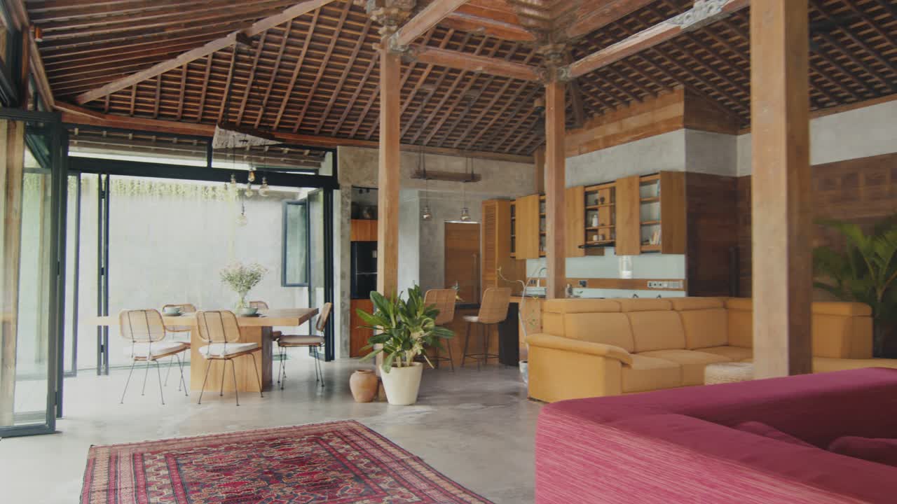 Country house with interior with sofa in living room combined with kitchen area