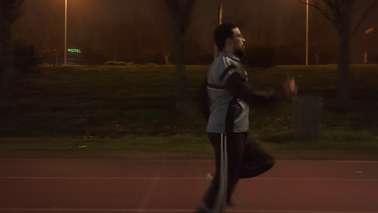 Tracking Shot of person increasing his speed while running in Salamanca city, Spain