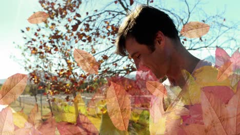 animation of autumn leaves frame over caucasian father and son in park