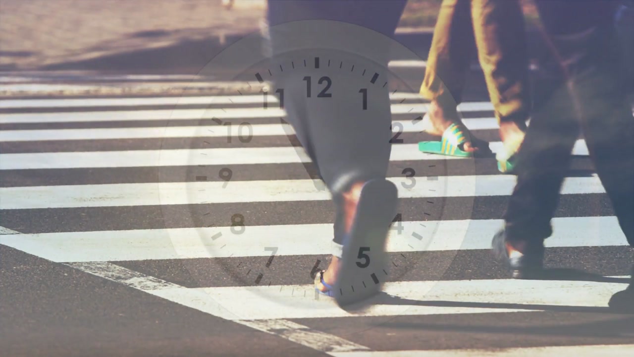 Vertical video: Showing clock advancing hands marking time as walker entering crosswalk car passing