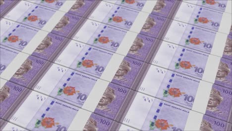 100 malaysian ringgit banknotes printed by a money press