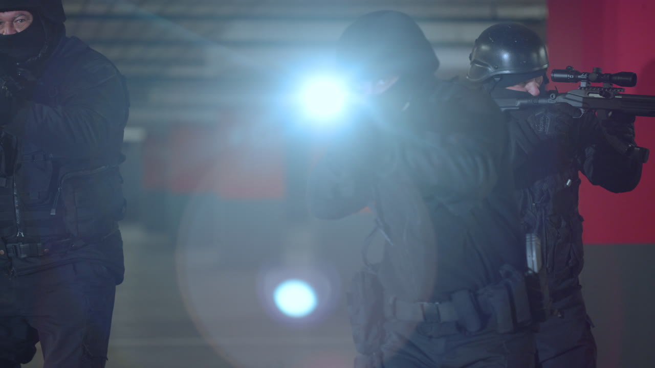 Premium stock video - Swat soldiers using rifles with flashlights ...