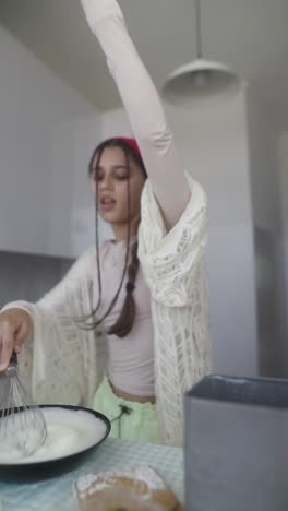 teenager baking in a kitchen