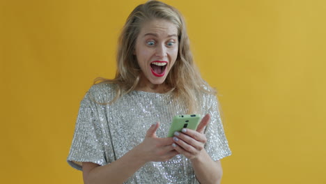 woman celebrating with confetti and smartphone