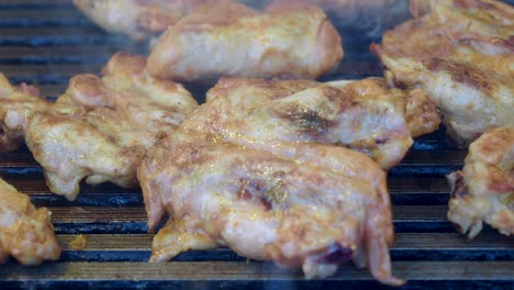 closeup of chicken grilling on a grill