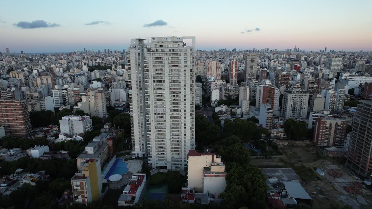 drone rising near large building and revealing a jungle of buildings in the capital of Argentina, Buenos Aires